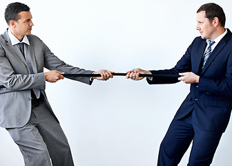 Image showing Businessmen, suits and determined with holding rope for competition, conflict and challenge. Male business people, standing and tug of war and drive with mockup in studio on white background