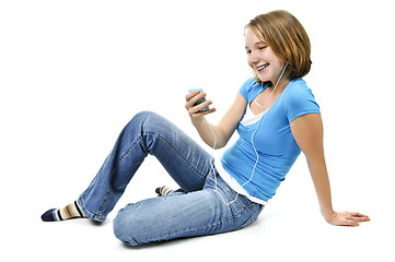 Image showing Teenage girl listening to music