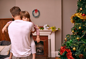 Image showing Father, son and embrace with comfort on christmas for celebration, sleeping and love in the morning. Family, man and child with hug, relax and enjoying holiday season in living room or lounge of home