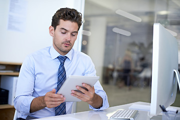 Image showing Tablet, reading and businessman in office for research on finance budget project for company. Computer, professional and male financial advisor working on account with digital technology in workplace