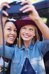 Image showing Women, friends and selfie photo with a camera on a holiday outside for a road trip. Photography, friendship and female people smiling for fun vacation on a picture break outdoors with fashion