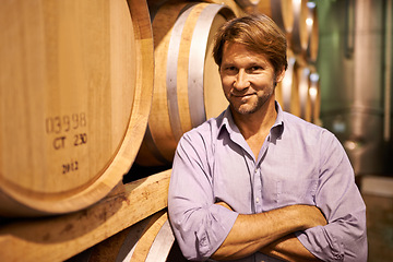 Image showing Portrait, smile and wine tasting with a man in the cellar of a distillery on a farm for the production of alcohol. Glass, industry and barrel with a happy male farmer or sommelier for quality control