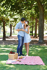 Image showing Date, picnic and surprise with couple in park for romance, bonding and summer vacation. Happiness, commitment and relax with man and woman in love in nature for blindfold, support and relationship