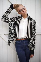 Image showing Portrait, woman and fashion with casual style and hair in a bun. Female person with a smile and trendy clothes while happy and confident for creative career with glasses as a young professional