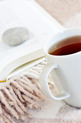 Image showing Relaxing reading with tea