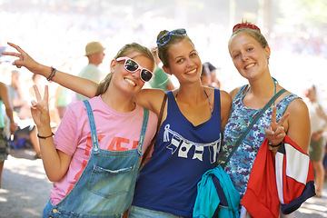 Image showing Portrait, friends and peace sign while bonding with smiles at outdoor music festival in Germany. Confident, relaxed and female students with happiness at outdoor event on summer or Spring afternoon