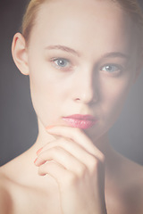 Image showing Woman, beauty and portrait with skincare, makeup and cosmetics with facial glow treatment. Studio, dermatology and female person from Switzerland with shine and wellness care with grey background