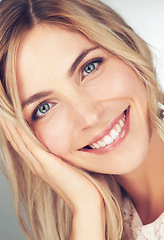 Image showing Closeup, makeup and portrait of woman with smile for cosmetic, beauty and healthy skin for wellness. Happy, face and female person with hand for relaxing with skincare, dermatology or self care