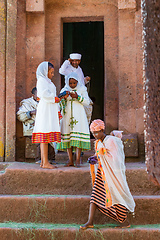 Image showing Orthodox christian Ethiopian people behind famous rock-hewn church, Lalibela Ethiopia people diversity,