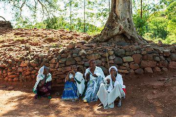 Image showing Orthodox christian Ethiopian people behind famous rock-hewn church, Lalibela Ethiopia people diversity,