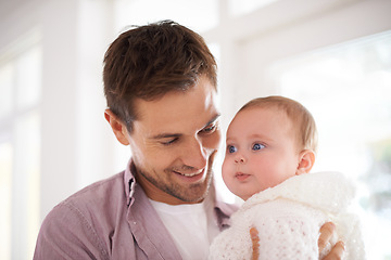 Image showing Father, happy and newborn baby with love, support and care for family, paternity and bonding. Excited dad, man or parent with his child or kid for childhood, development and growth or nurture at home