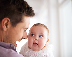 Image showing Love, father and baby with face in home for bonding, comfort and playing together for healthy development. Family, man and newborn child with smile, embrace and relax for parenting, care and security