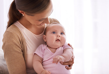 Image showing Mom, hug and baby with love, support and care for family, bonding and maternity at home. Happy mother, parent or woman playing with her newborn child or infant for development, excited and growth