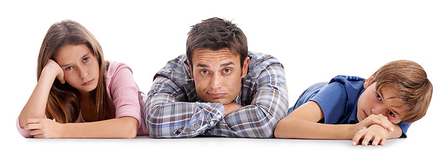 Image showing Floor, bored and portrait of father with children on a white background for bonding, relationship and love. Family, parenthood and unhappy dad, girl and boy for rest, care and relaxing in studio