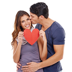 Image showing Couple, kiss and heart paper in studio for romance, love and happy portrait with hug on a white background. Young woman and man together with affection, love and mockup or space for valentines day