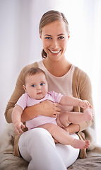 Image showing Mother, portrait and newborn baby on bed with love, support and care for family on maternity. Happy mom, parent or woman relaxing with her child or infant for childhood development and growth at home