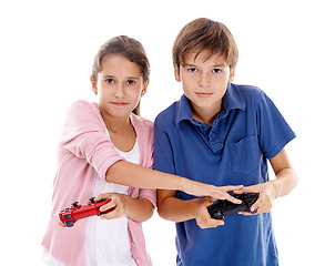 Image showing Children, video game and controller for siblings in studio, portrait and competition by white background. Girl, boy or family kids with gaming, press and contest with strategy, cheating or playing