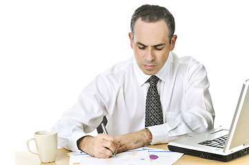 Image showing Office worker studying reports