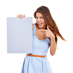 Image showing Portrait, excited and woman pointing at poster for mockup, space or advertising isolated on white studio background. Presentation, sign and happy person with hand gesture for marketing, sale or offer