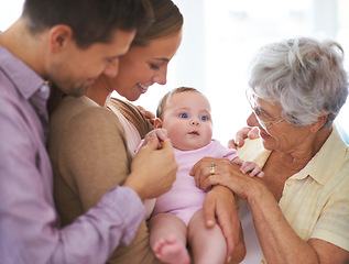 Image showing Family, grandmother with baby and parents are happy at home, people bonding with love and relationship. Support, trust and care, smile for pride and generations, childhood and connect with infant