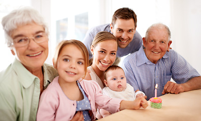 Image showing Family, portrait and birthday party, cupcake and candle to celebrate and happy people at home. Parents, grandparents and children with cake or dessert for anniversary and generations with smile