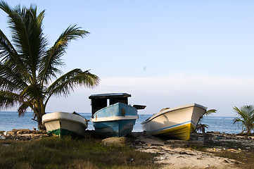 Image showing three fishing boats on shore caribbean sea