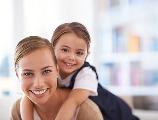 Image showing Mother, kid and piggyback in portrait with games in family home, love and bonding with smile while playing. Playful woman, young girl and happy in living room with fun time together for childhood