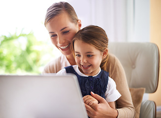 Image showing Laptop, remote education and mother with daughter on sofa in living room of home to study together. School, elearning or homework class with woman parent and girl child in apartment for growth