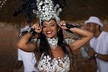 Image showing Woman, happy and samba performance at night for celebration in Rio de janeiro for carnival season. Female person, costume and feathers for culture and life, creativity and confidence at festival