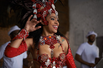 Image showing Carnival, dance and woman in costume for event in Brazil, performer or dancer with gemstone outfit outdoor. Music, band and samba with happiness for entertainment and culture, festival and talent