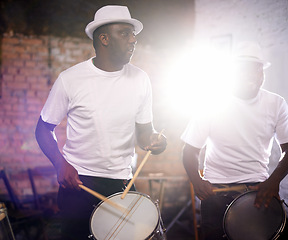 Image showing Man, drums and band playing with instrument at festival, carnival or party together with lens flare. Male person, talented drummer or young group of musicians at night concert or music event in Rio