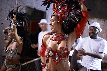 Image showing Happy woman, samba and dance at music festival, carnival or night performance with costume and band. Excited dancer, group and drummer for event, celebration and culture or history in Rio de Janeiro