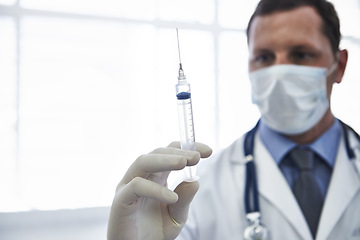 Image showing Doctor, syringe and vaccine injection with needle for disease treatment for influenza virus, antibiotic or healthcare. Male person, face mask and immunization shot in hospital, booster or prevention