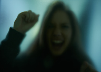 Image showing Scary, scream and woman with hand on glass, window or person trapped in home. Girl, shadow and figure in horror, drama or creepy aesthetic with angry shouting from terror in house with fog on screen