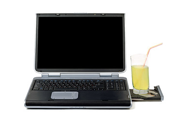 Image showing Laptop and cocktail. Isolated on white background