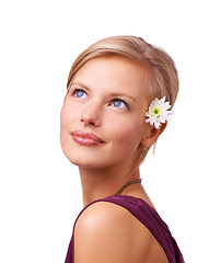 Image showing Woman, closeup and face with flower isolated on white studio background for beauty, cosmetics and makeup campaign. Female person, model and smile in happiness for skin care, glamor and elegance