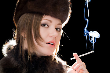 Image showing Portrait of the beautiful young woman with a cigarette