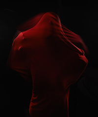 Image showing Scary, person and trapped in fabric for horror, art and drama on black background in studio. Suffocating, fear and model stuck in cloth as demon, monster or ghost with terror for creative aesthetic