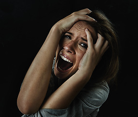 Image showing Portrait, horror and fear with woman screaming in studio on black background for reaction to danger. Face, stress and mental health with scared young person in dark for phobia, nightmare or terror