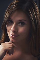 Image showing Woman, portrait and beauty in studio, cosmetics and satisfaction for skincare on black background. Female person, facial treatment and touch for dermatology, confidence and pride for glowing skin