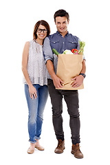 Image showing Happy couple, portrait and shopping with grocery bag for food, natural sustainability or nutrition on a white studio background. Young man and woman with smile for healthy vegetables or ingredients