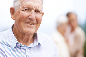 Image showing Elderly, man and happy portrait outdoor on holiday, vacation and travel for retirement with confidence. Senior, person and face with smile in garden, nature or backyard of home for relax and break