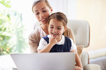 Image showing Laptop, education or elearning with woman and daughter on sofa in living room of home to study together. School, remote lesson or homework with mother and girl child in apartment for development