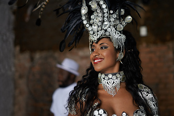 Image showing Happy woman, samba dancer and tradition with costume for performance at carnival or festival. Face of female person or exotic performer with smile and cultural fashion for dancing or concert in Rio