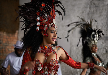 Image showing Carnival, dancing and woman in costume for event in Brazil, performer or dancer with gemstone outfit outdoor. Music, band and samba with happiness for entertainment and culture, festival and talent