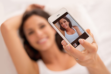 Image showing Woman, selfie and phone screen in morning, bed and relax with photography on web blog. Girl, person and influencer for profile picture, click and ux for live streaming in bedroom on social network