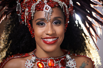 Image showing Woman, portrait and samba performance at night for carnival season in Rio de janeiro, celebration and happy with costume for culture. Female person, festival and unique fashion for dancing at parade