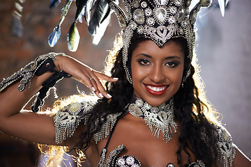 Image showing Happy woman, portrait and samba dancer with costume for performance at carnival or festival. Face of female person or exotic performer with smile and cultural fashion for dancing or concert in Rio