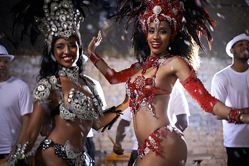 Image showing Samba, portrait and performance of women in Rio de Janeiro, smile and dancing for crowd with energy. Female people, artistic and clothes from feather for fashion with culture, music and celebration