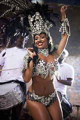 Image showing Carnival, dance and woman for performance in Brazil, dancer with gemstone outfit and feather head gear outdoor. Music, samba and happiness for event and culture with festival entertainment and talent